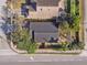 Overhead shot of a house with a dark gray roof with nearby street and sidewalks at 1493 Hyde Park Dr, Winter Park, FL 32792