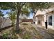 View of a backyard that includes a firepit, grill, and covered patio area at 1493 Hyde Park Dr, Winter Park, FL 32792