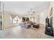 Cozy living room with tile floors, comfortable seating, and ample natural light at 1493 Hyde Park Dr, Winter Park, FL 32792