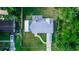 Birds eye view of the home featuring a metal roof, fenced yard, and driveway at 15 Palmira Rd, Debary, FL 32713