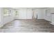 Spacious living area with wood-look floors and ample natural light at 15 Palmira Rd, Debary, FL 32713