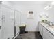 Bright bathroom featuring double sinks, a shower stall, and plank flooring at 15036 Willow Arbor Cir, Orlando, FL 32824