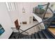 Grand foyer with soaring ceilings, modern chandelier, and staircase with decorative metal railing at 15469 Shorebird Ln, Winter Garden, FL 34787