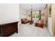 Cozy living room features unique leather furniture and large windows at 15469 Shorebird Ln, Winter Garden, FL 34787