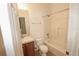 This is a full bathroom featuring a shower-tub combo and single vanity at 17519 Blessing Dr, Clermont, FL 34714