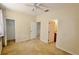 This carpeted bedroom features white door trim, and a ceiling fan at 17519 Blessing Dr, Clermont, FL 34714