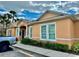 Exterior view of the community clubhouse, featuring lush landscaping and inviting entrance at 17519 Blessing Dr, Clermont, FL 34714