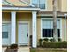 Inviting front door entrance with white columns and well-maintained landscaping at 17519 Blessing Dr, Clermont, FL 34714