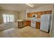 Functional kitchen with white appliances, and tile flooring at 17519 Blessing Dr, Clermont, FL 34714