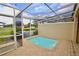 This screened in pool is surrounded by brick pavers at 17519 Blessing Dr, Clermont, FL 34714