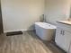 Modern bathroom featuring a freestanding tub and granite countertops at 1958 Sawfish Dr, Kissimmee, FL 34759