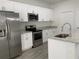 Well-equipped kitchen featuring stainless steel appliances and modern cabinetry at 1958 Sawfish Dr, Kissimmee, FL 34759