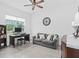 Comfortable spare bedroom featuring tile floors, a ceiling fan, and ample natural light at 2091 Brillante Dr, St Cloud, FL 34771