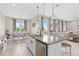 Open-concept kitchen island featuring granite countertops, a stainless dishwasher, and a dining area at 2091 Brillante Dr, St Cloud, FL 34771
