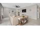 Bright living room with a neutral-colored couch, a ceiling fan and access to other parts of the home at 2091 Brillante Dr, St Cloud, FL 34771