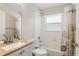 Well-lit bathroom featuring a shower-tub combo, neutral color scheme, and a vanity with ample counter space at 2209 Hannah Ln, Orlando, FL 32826