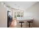 Eat-in kitchen featuring counter seating and modern black appliances at 2209 Hannah Ln, Orlando, FL 32826