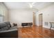 Well-lit living room featuring sleek flooring, a modern sofa, and neutral walls at 2209 Hannah Ln, Orlando, FL 32826