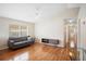 Inviting living room featuring a modern sofa, sleek flooring, and a bright window at 2209 Hannah Ln, Orlando, FL 32826