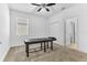 Bedroom with a massage table, ceiling fan and neutral colored carpet and walls at 2246 Rush Bay Way, Orlando, FL 32824