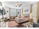 Comfortable bedroom with neutral tones, plantation shutters, modern ceiling fan, and stylish decor at 2246 Rush Bay Way, Orlando, FL 32824