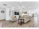 Bright living room featuring a built-in entertainment center, wood floors, and modern furnishings at 2246 Rush Bay Way, Orlando, FL 32824