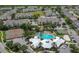 An aerial image showcasing a community pool and tennis courts, offering recreational activities for residents and families at 2318 Silver Palm Dr, Kissimmee, FL 34747