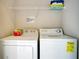 Functional laundry room with a washer, dryer, and an overhead storage shelf at 2318 Silver Palm Dr, Kissimmee, FL 34747