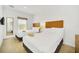 A bright and airy bedroom has two beds and a window that gives lots of natural light at 2647 Corvette Ln, Kissimmee, FL 34746