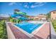 The community features a waterpark-style pool and seating areas at 2647 Corvette Ln, Kissimmee, FL 34746