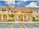 Charming townhome with a private entrance, tile roof, and well-maintained landscaping at 2647 Corvette Ln, Kissimmee, FL 34746