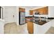 Kitchen featuring stainless steel appliances, granite countertops and wood cabinets at 2647 Corvette Ln, Kissimmee, FL 34746