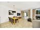Bright dining and living room with access to the outdoor patio at 2647 Corvette Ln, Kissimmee, FL 34746