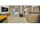 Bright dining and living room with access to the outdoor patio and a cozy seating area at 2647 Corvette Ln, Kissimmee, FL 34746