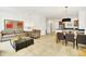 Comfortable living room featuring tile flooring, sofa, chairs, and decor for relaxed gatherings at 2647 Corvette Ln, Kissimmee, FL 34746