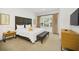 Comfortable main bedroom with large window and decorative details, creating a serene atmosphere at 2647 Corvette Ln, Kissimmee, FL 34746