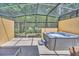View of screened-in lanai and hot tub at 2647 Corvette Ln, Kissimmee, FL 34746