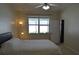 Bedroom with neutral colors, comfortable queen bed, ample natural light, and ensuite bath at 2657 Youngford St, Orlando, FL 32824