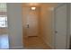 Inviting foyer with tile flooring, leading to other areas of the home, with a front door at 2657 Youngford St, Orlando, FL 32824