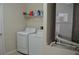 Laundry room with washer and dryer, with an air conditioning unit to the side at 2657 Youngford St, Orlando, FL 32824