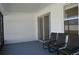 Relaxing enclosed patio featuring a sliding glass door and three chairs at 2657 Youngford St, Orlando, FL 32824