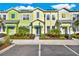 Colorful townhome exteriors, featuring vibrant Caribbean-inspired designs and well-maintained landscaping at 2925 Caribbean Soul Dr, Kissimmee, FL 34747