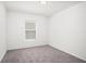 Neutral bedroom with gray carpet, a window and overhead lighting at 3201 Sweet Acres Pl, St Cloud, FL 34772