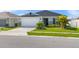 Well-maintained single-Gathering home featuring lush landscaping and a paved driveway at 3201 Sweet Acres Pl, St Cloud, FL 34772