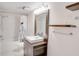 Clean, well-lit bathroom featuring a modern sink vanity, tiled shower, and minimalist decor elements at 4086 Biscayne Ct, Casselberry, FL 32707