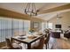 Open dining area featuring a modern chandelier and views of the connected living spaces at 4086 Biscayne Ct, Casselberry, FL 32707