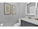 Neutral bathroom with a sleek vanity and well-lit mirror at 4431 Le Reve Ct, Kissimmee, FL 34746