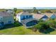 Aerial view of backyard featuring a screened-in pool and well maintained lawn at 5239 Los Palma Vista Dr, Orlando, FL 32837