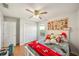 Bedroom featuring a bed with stuffed animals and a mushroom poster, with a closet at 5239 Los Palma Vista Dr, Orlando, FL 32837