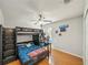 bedroom featuring a bunk bed with storage, a desk, and playful decor at 5239 Los Palma Vista Dr, Orlando, FL 32837